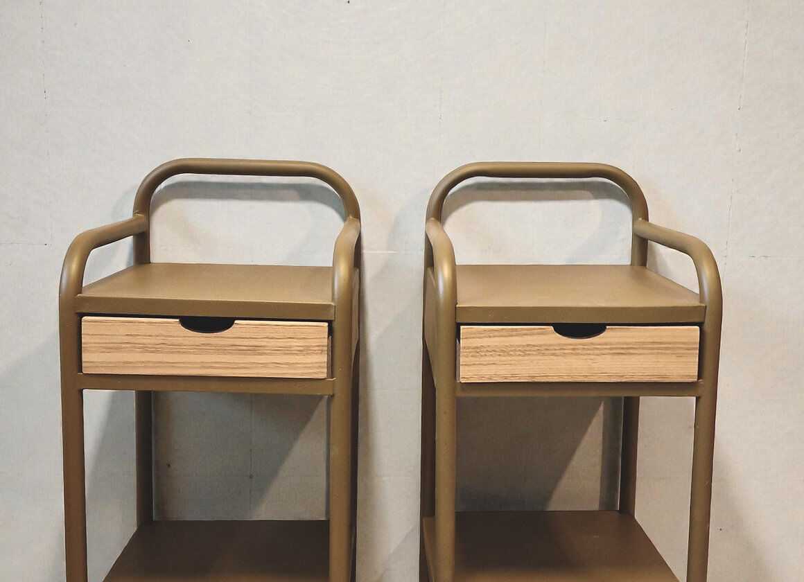 Old ochre metal bedside tables from a boarding school.