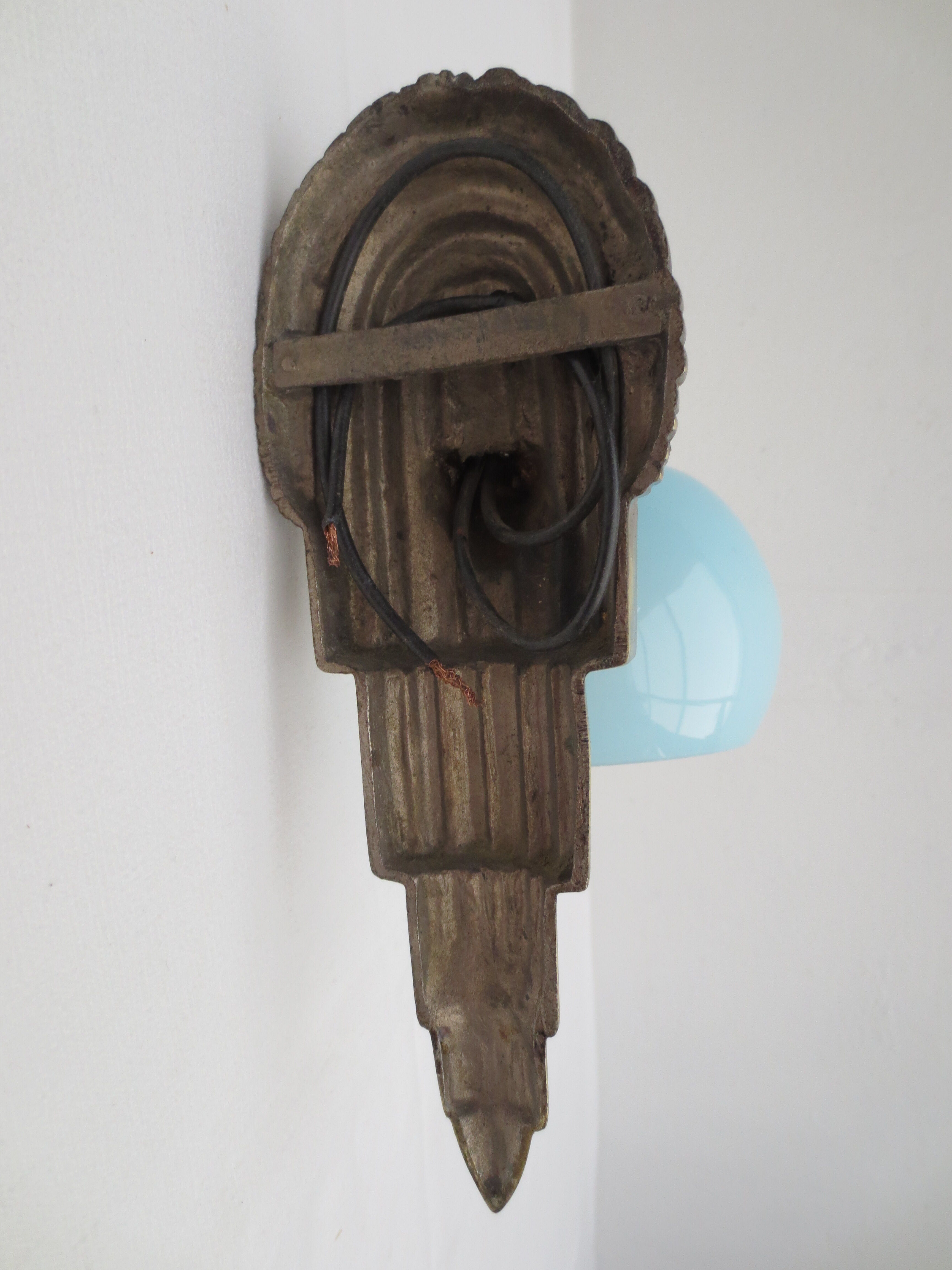 Art deco wall lamp in brass and soft blue opaline globe