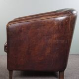 Dark sheep leather club armchair, sleek design