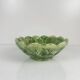 Leaf and strawberry-shaped bowl/strainer.