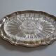 Silver-plated metal aperitif serving tray with HKE hallmark and glass.