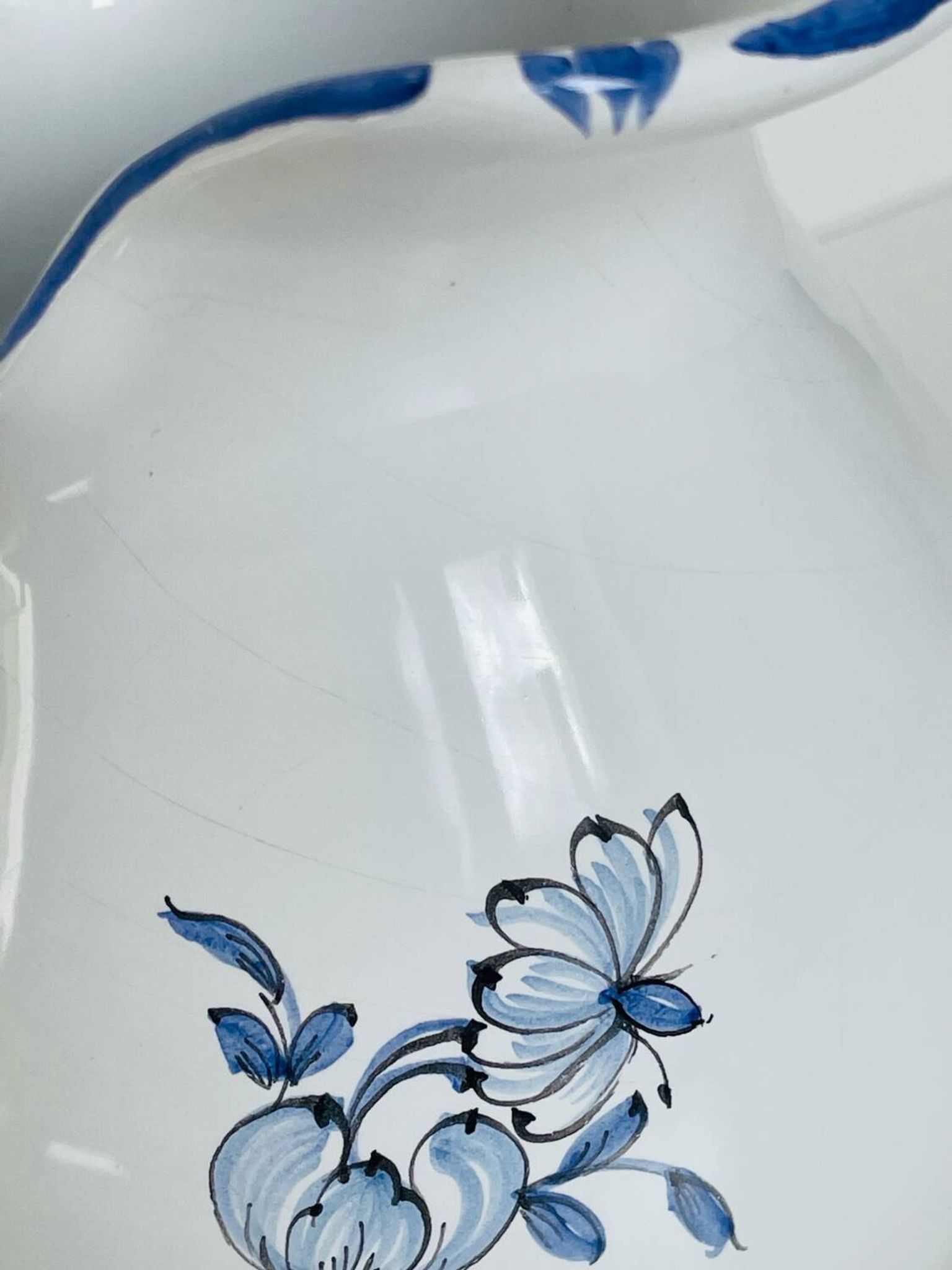 Moustiers pitcher with blue floral decoration