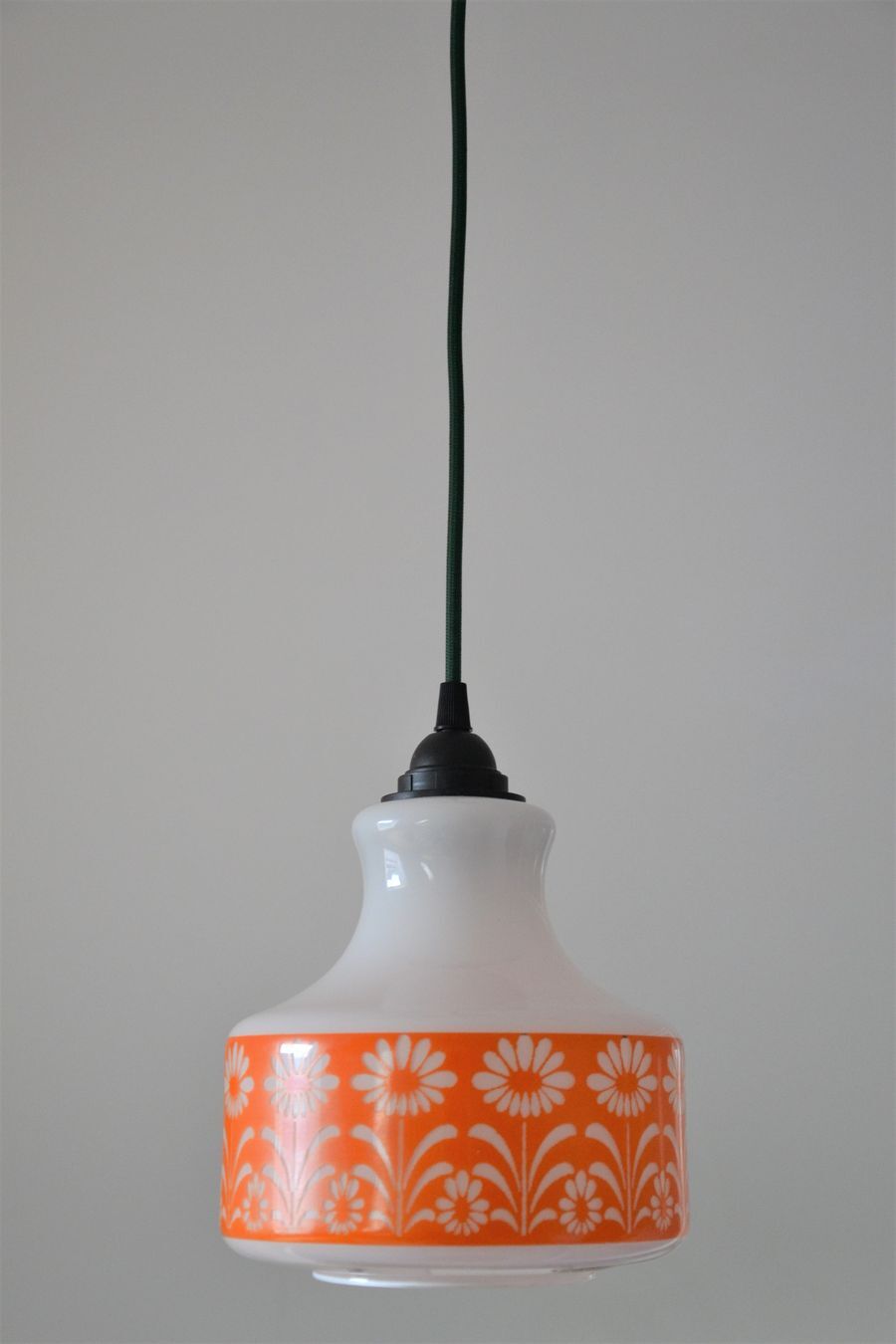 Seventies chandelier in white opaline decorating orange flowers