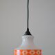 Seventies chandelier in white opaline decorating orange flowers