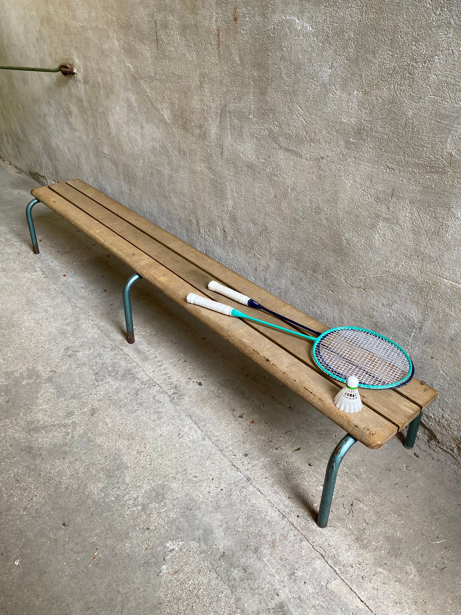 Vintage wood kindergarten bench and tubular structure in long