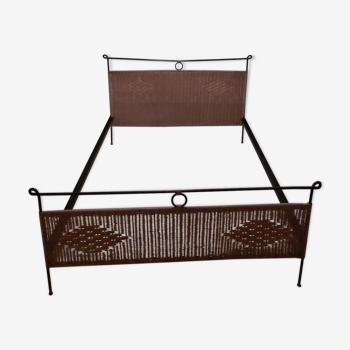 Black metal and rattan bed frame