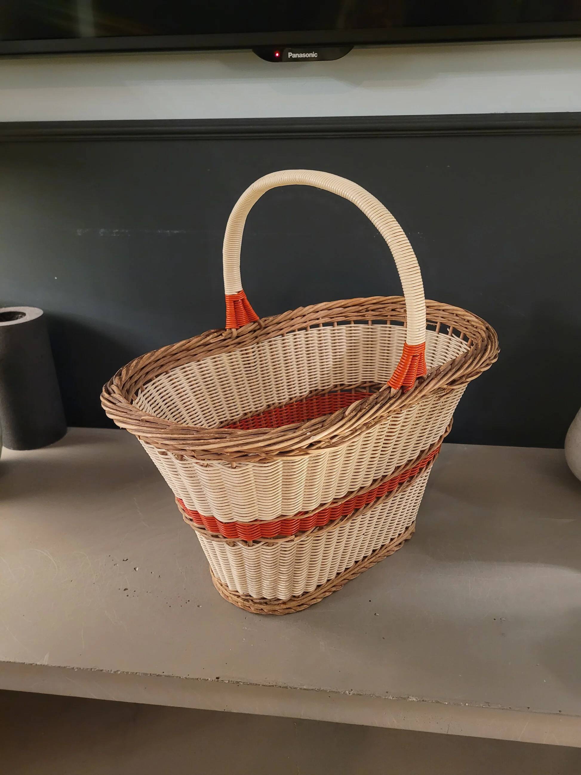 Old oval basket with a wooden base