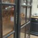 Former Library Showcase in solid oak and black patinated fir 1920