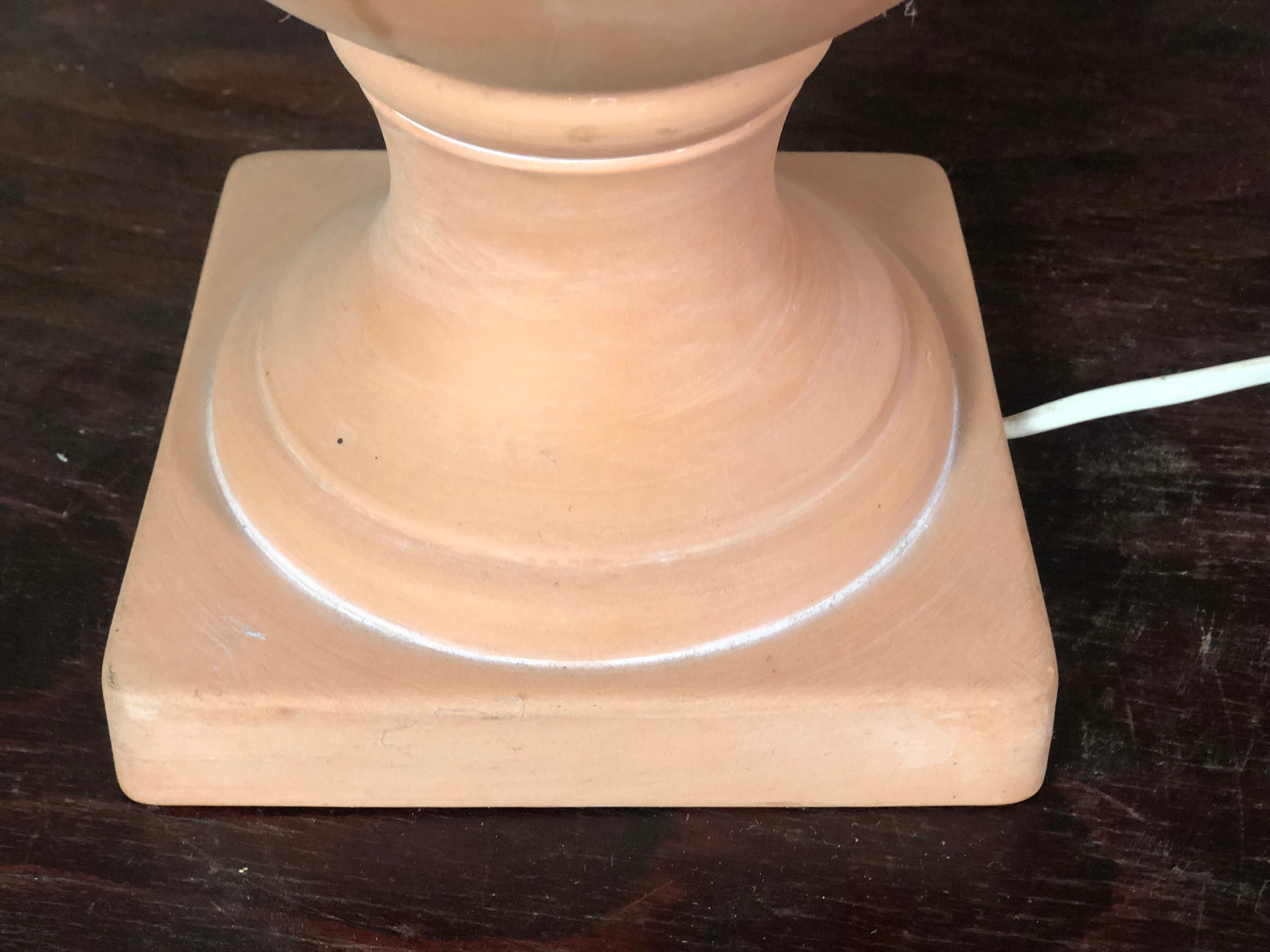 Terracotta lamp decorated with fruit crown