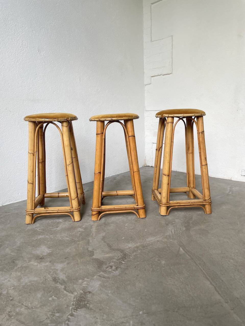 Set of three rattan high stools