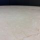 Round French travertine dining table 1970s