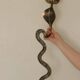 Pair of Neo-Egyptian Style Engraved Brass Wall Sconces Featuring Cobras