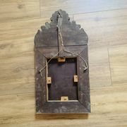 Small mirror with repoussé brass frame.