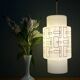 Vintage suspension globe in white opaline with black drawings.