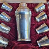 Shaker and 8 silver St Médard cups