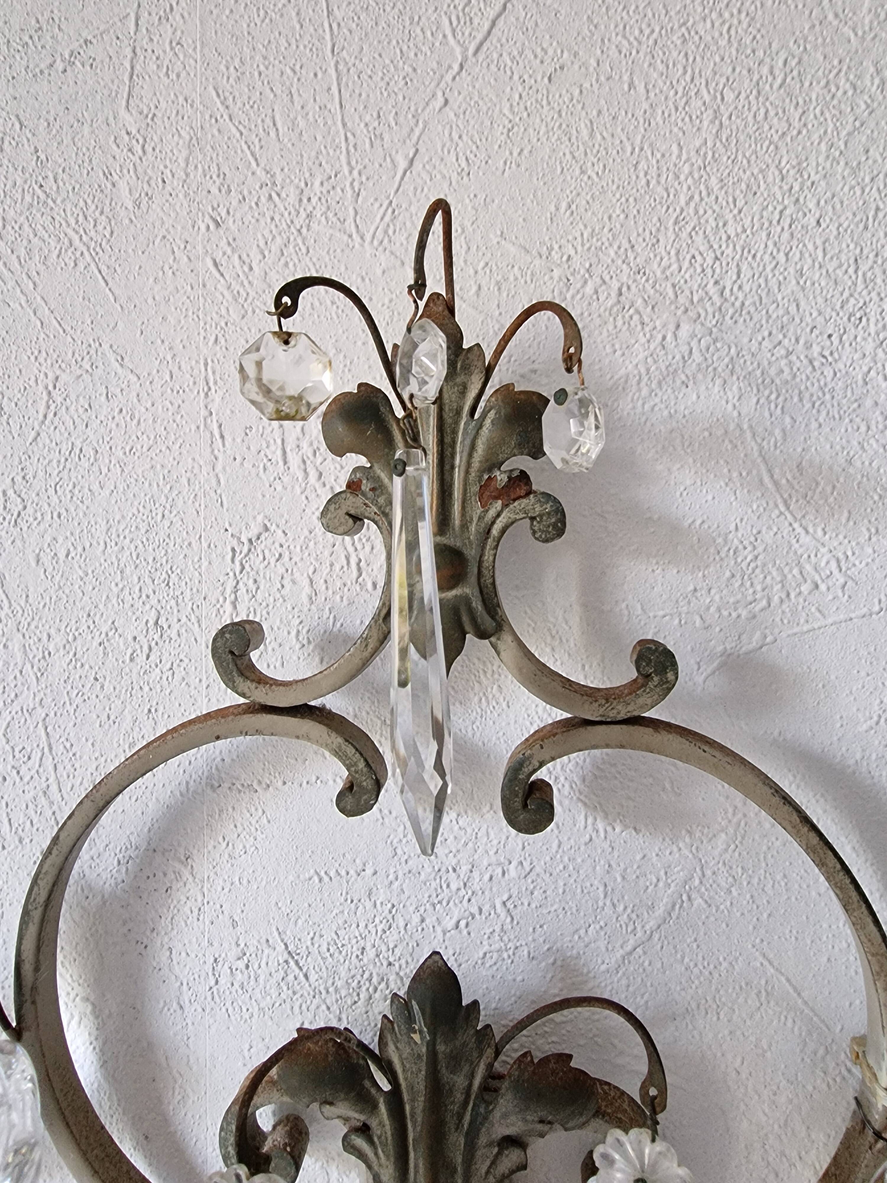 Pair of sconces in patinated metal and crystal tassels