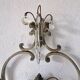 Pair of sconces in patinated metal and crystal tassels