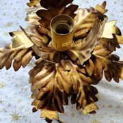 Vintage floral metal applique in gold.