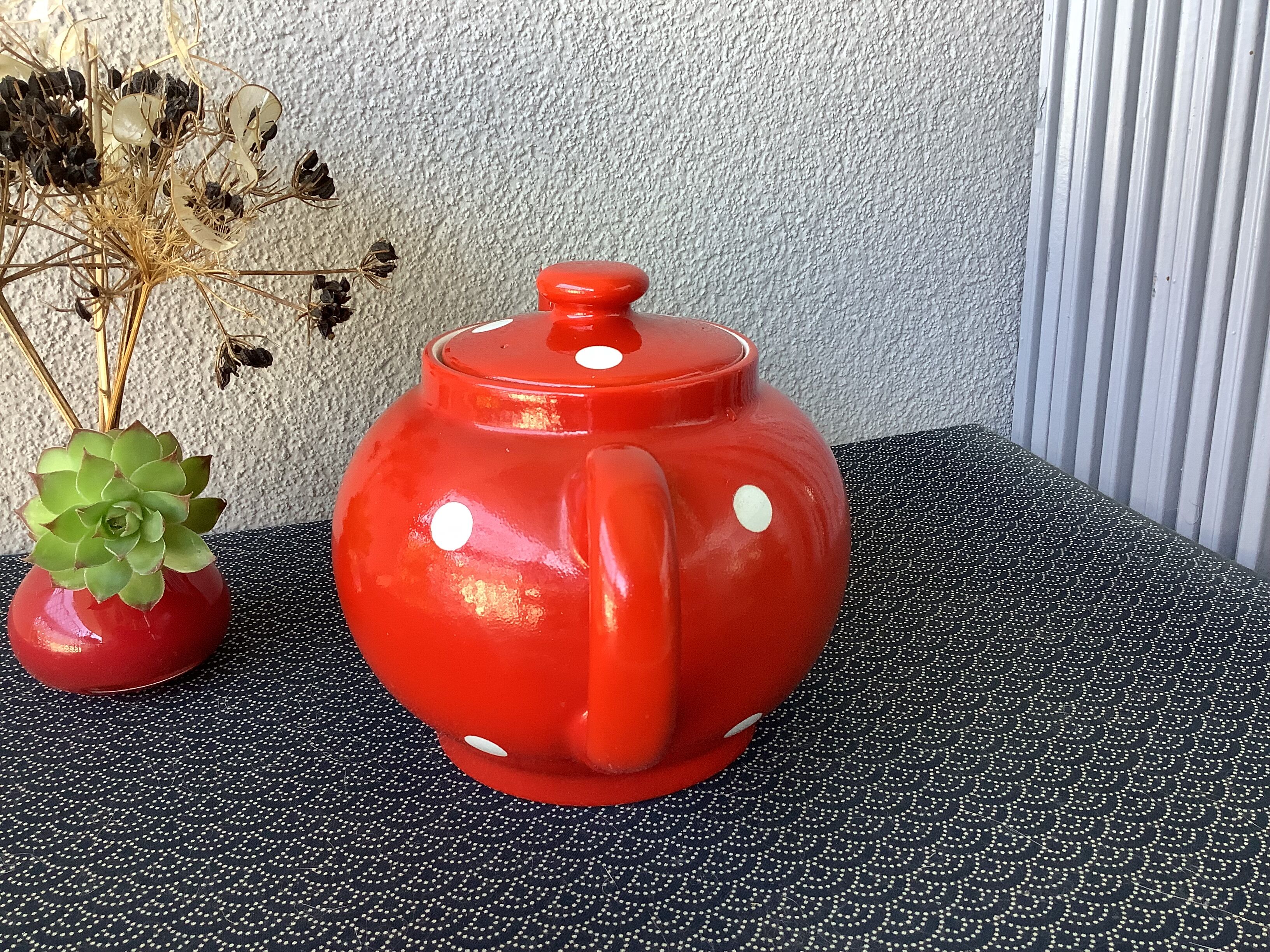 Vintage red teapot with white polka dots