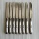 8 silver-plated metal knives, engraved handles with refined details.