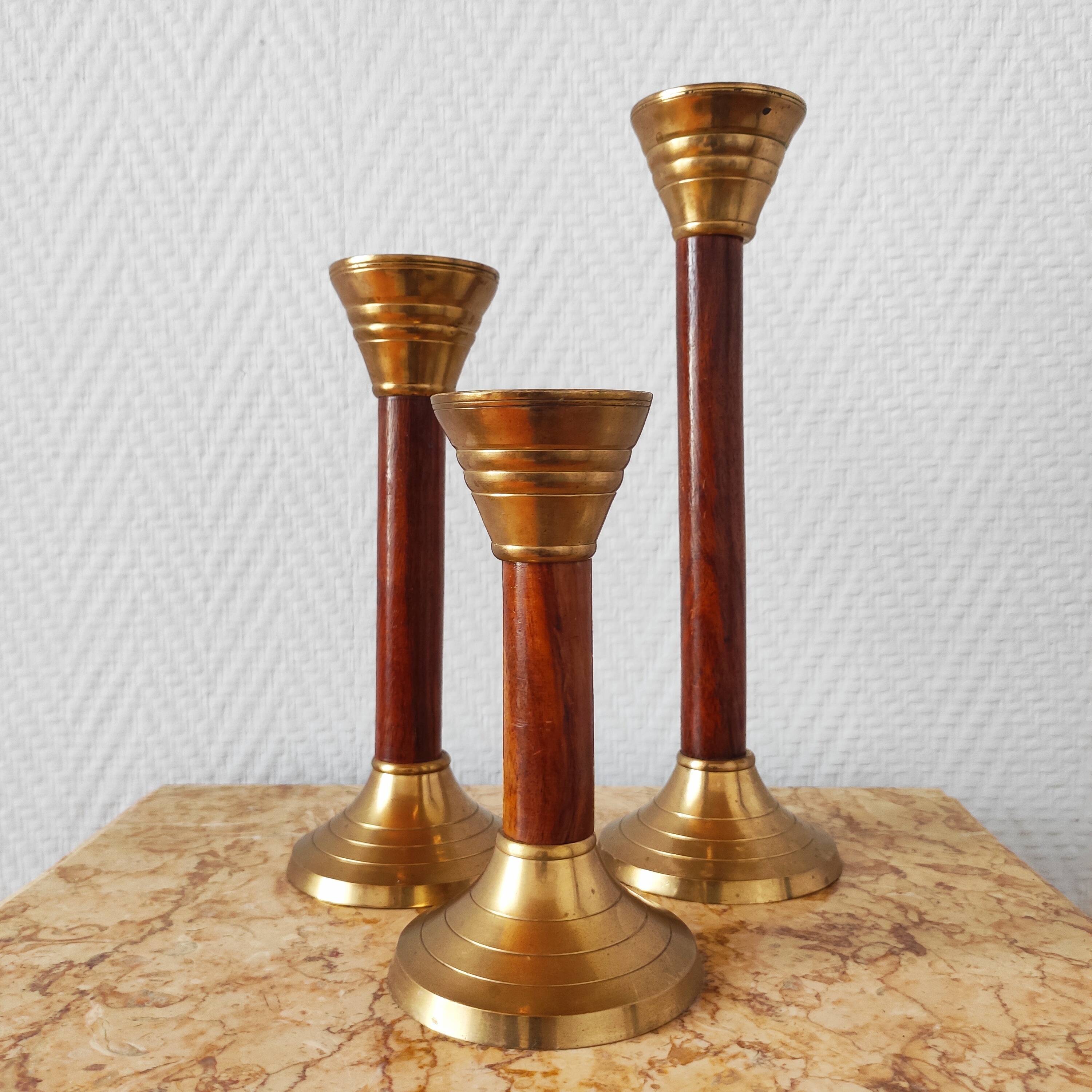 Set of three vintage wooden and brass candlesticks
