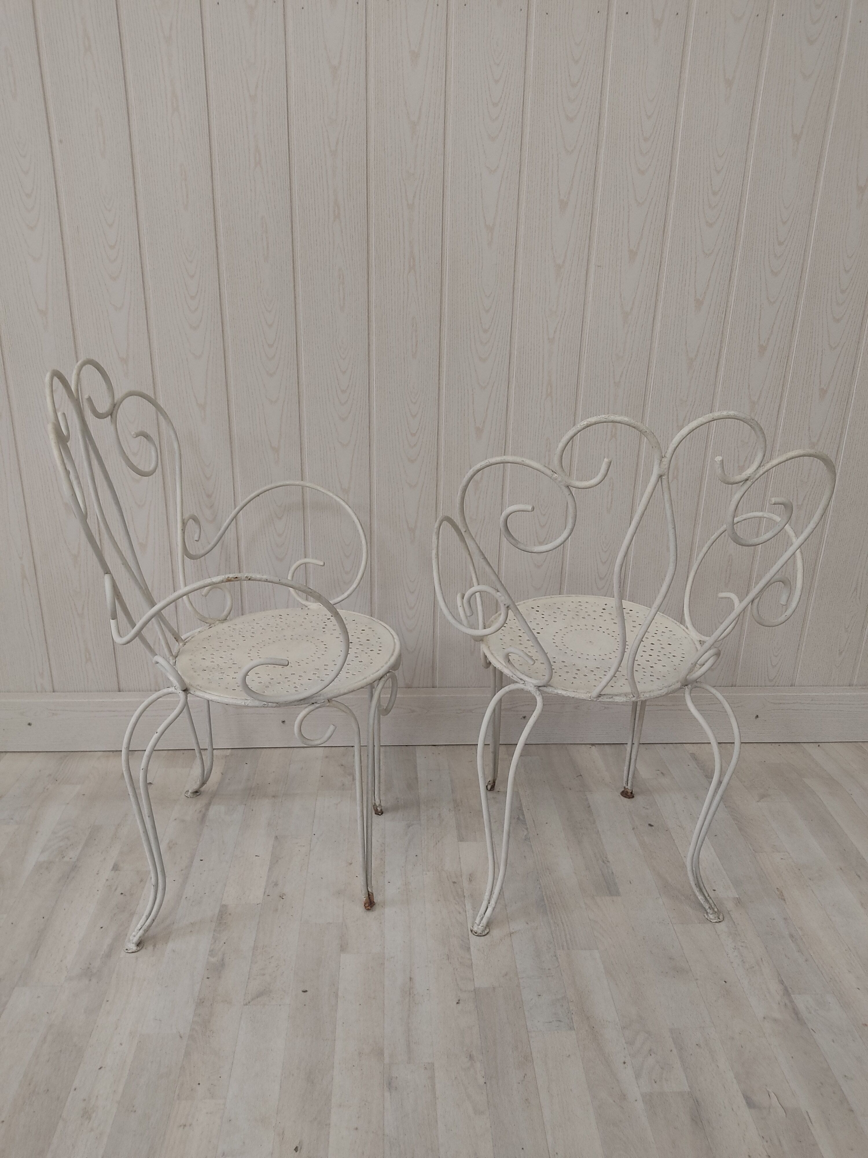 Pair of wrought iron garden chairs
