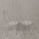 Pair of wrought iron garden chairs
