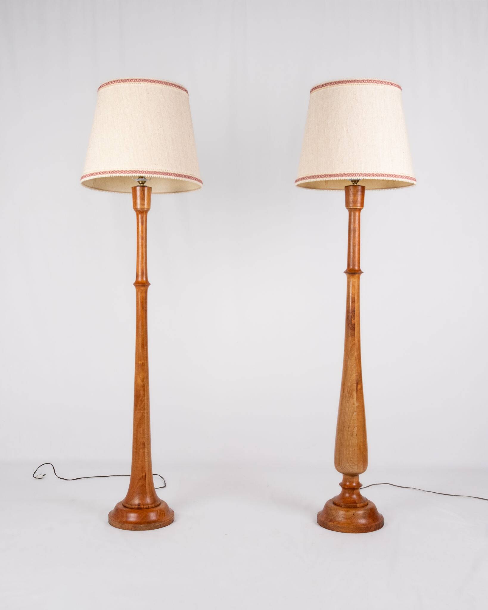 Pair of turned wooden floor lamps in Art Deco style, France, mid-20th century.