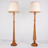 Pair of turned wooden floor lamps in Art Deco style, France, mid-20th century.