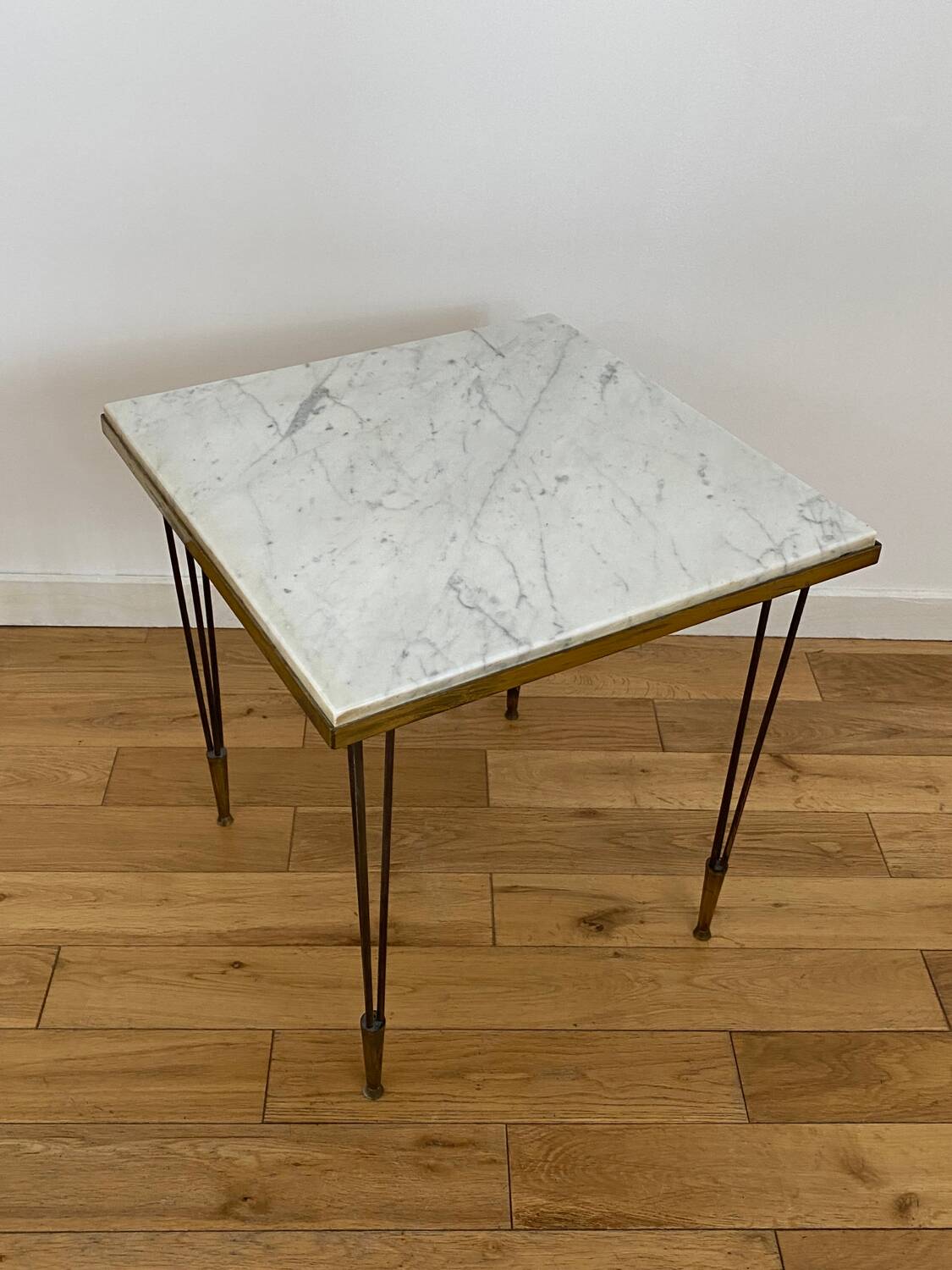 End table in gold metal, white marble top. 60s