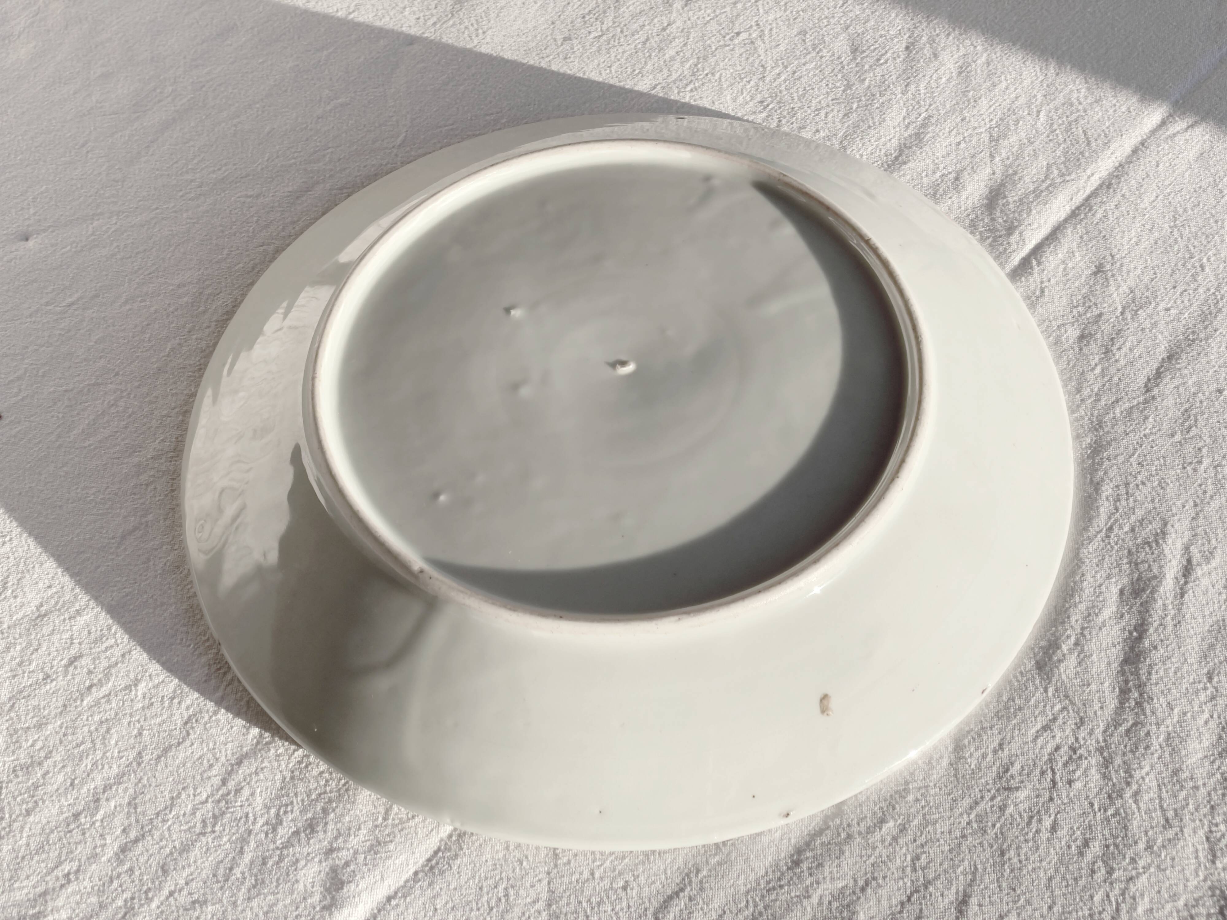 Yellow porcelain plate with saturated and vivid colors. Handmade in Japan