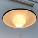 Minimalist metal and glass pendant lamp in mid-century style.