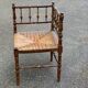 19th-century solid wood corner chair with red and blue rush seating.