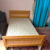 Vintage 1970s single rattan bed in blond wood
