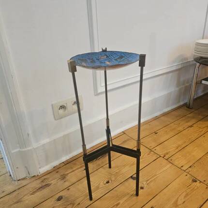 Vintage tripod metal side table with a blue brass bowl.