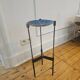 Vintage tripod metal side table with a blue brass bowl.