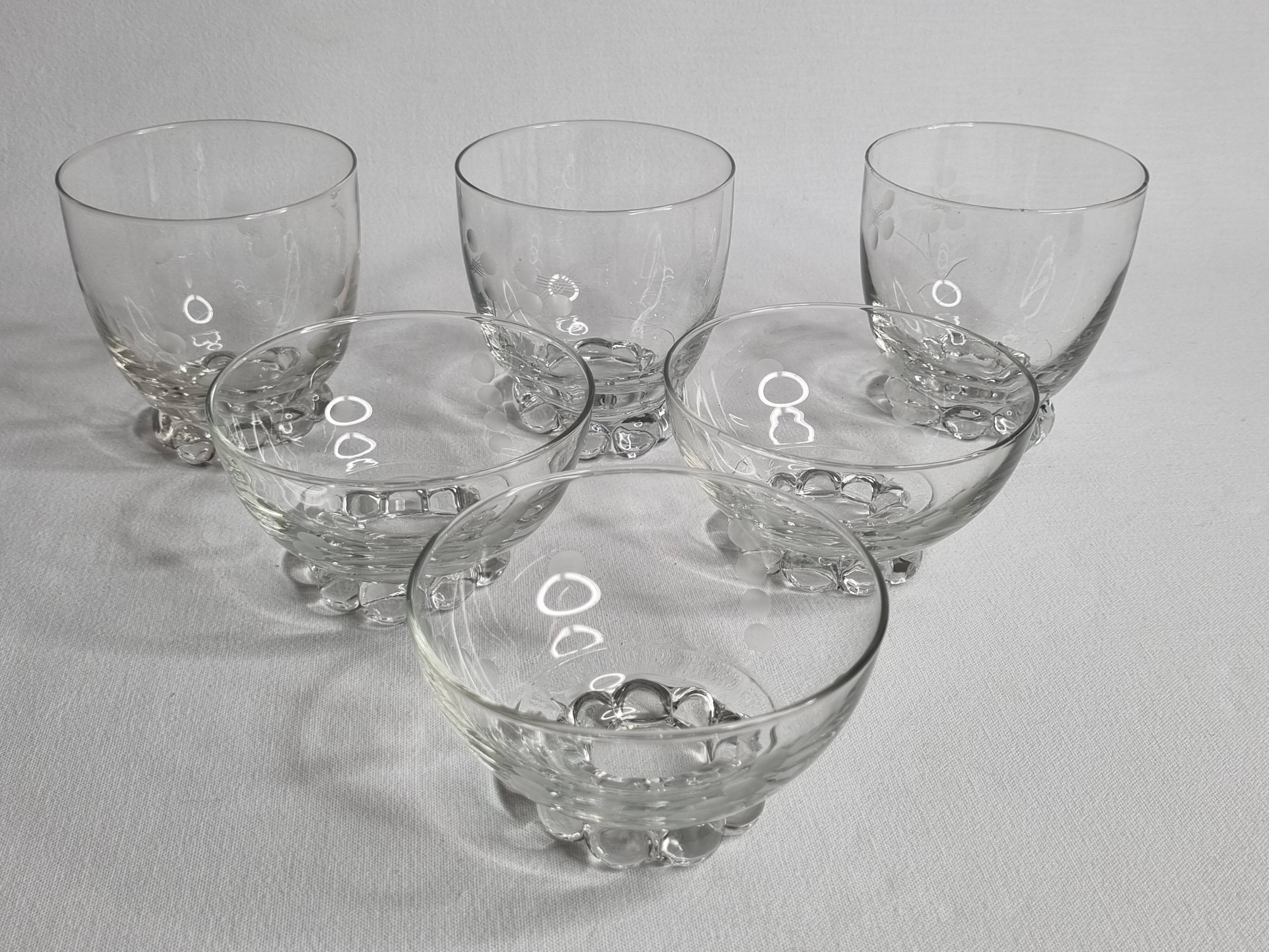 Set of Art Deco style engraved crystal bowls and glasses on spherical feet