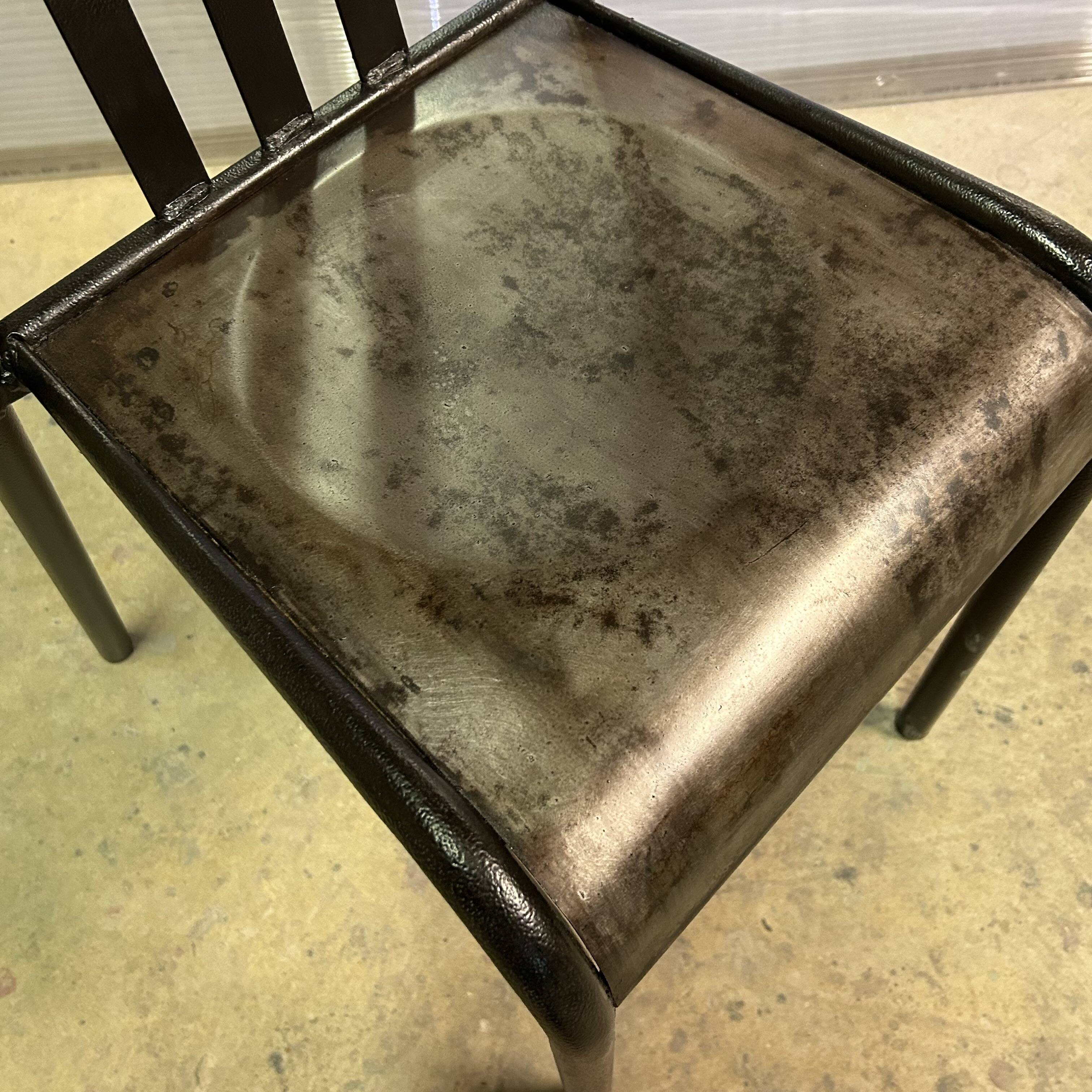 Two vintage slatted chairs.