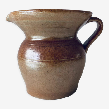 Old pitcher in glazed terracotta