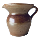 Old pitcher in glazed terracotta