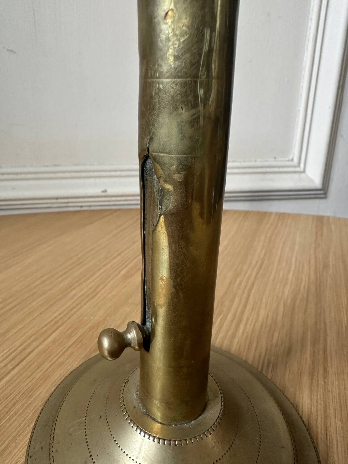 Old brass pull candle holder