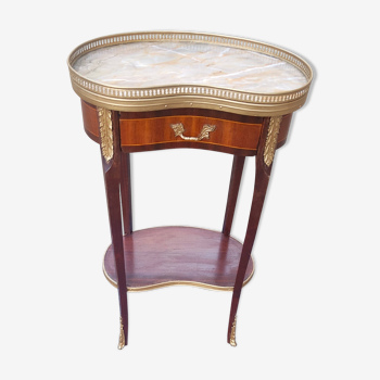 Louis XVI period pedestal table, in solid mahogany and veneer, and in gilded bronze.