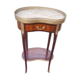 Louis XVI period pedestal table, in solid mahogany and veneer, and in gilded bronze.