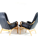 Pair of vintage leather lounge armchairs 70s