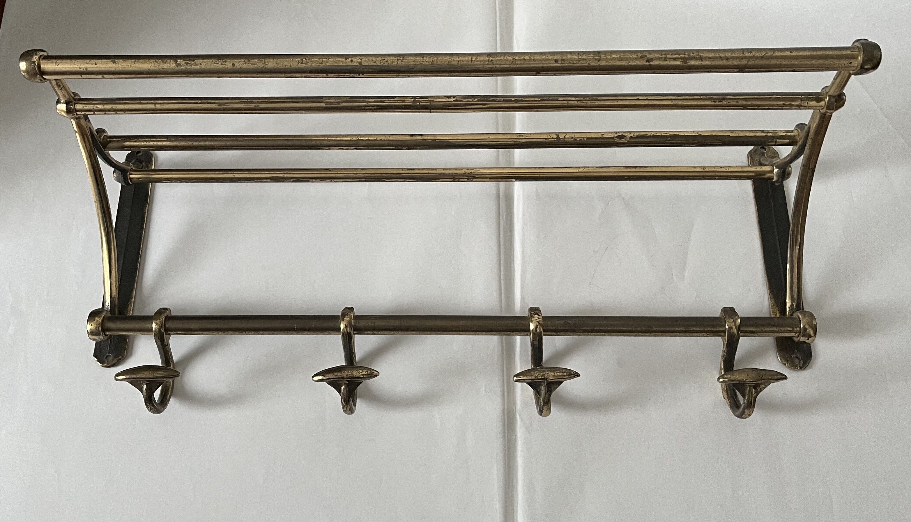Antique coat rack in gilded metal