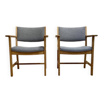 A pair of armchairs stamped "hans wegner" 1960.