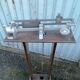Old scale at pharmacy wood house rongier weighs person