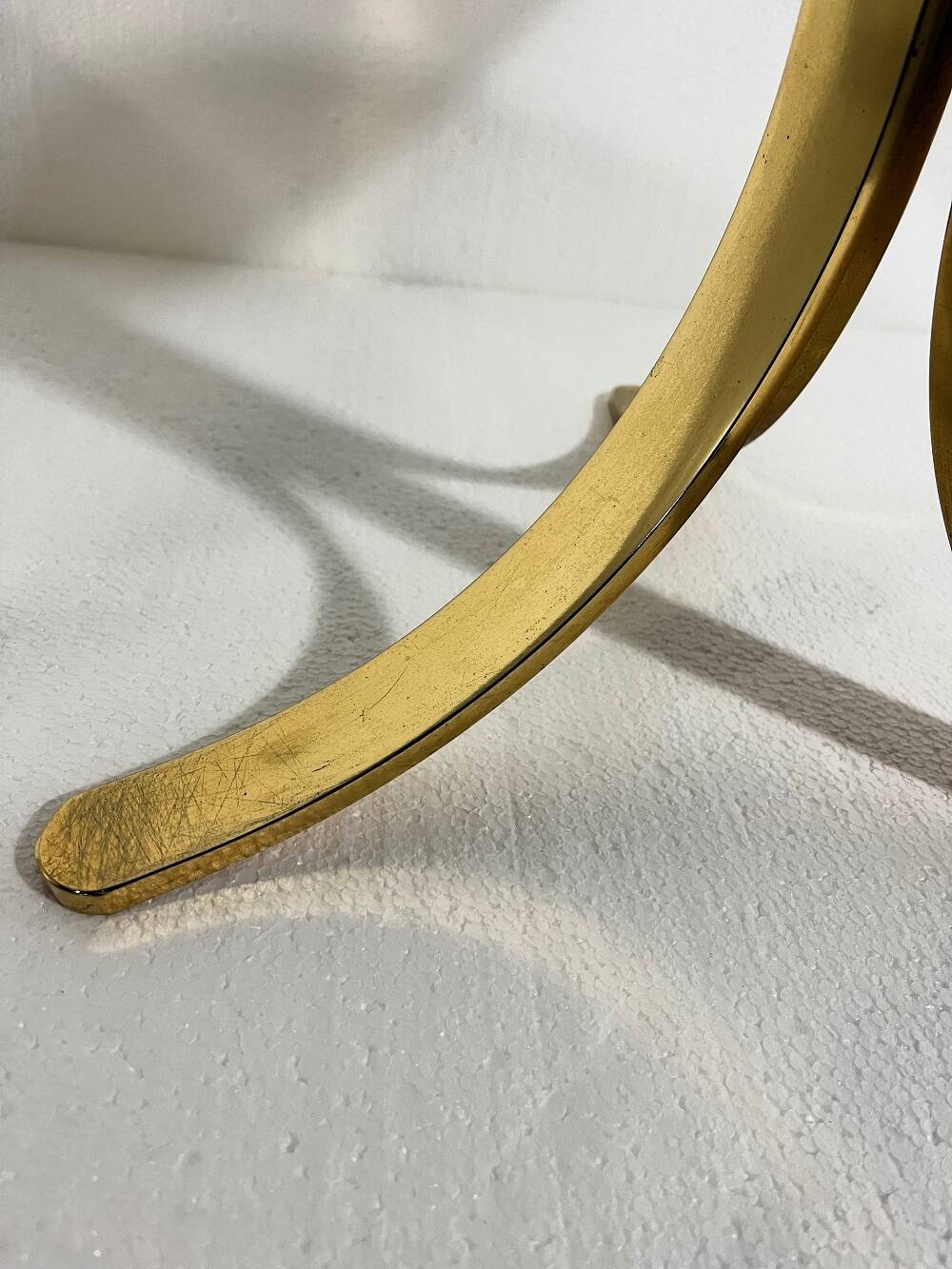 Brass and smoked glass side tables from the 1960s.