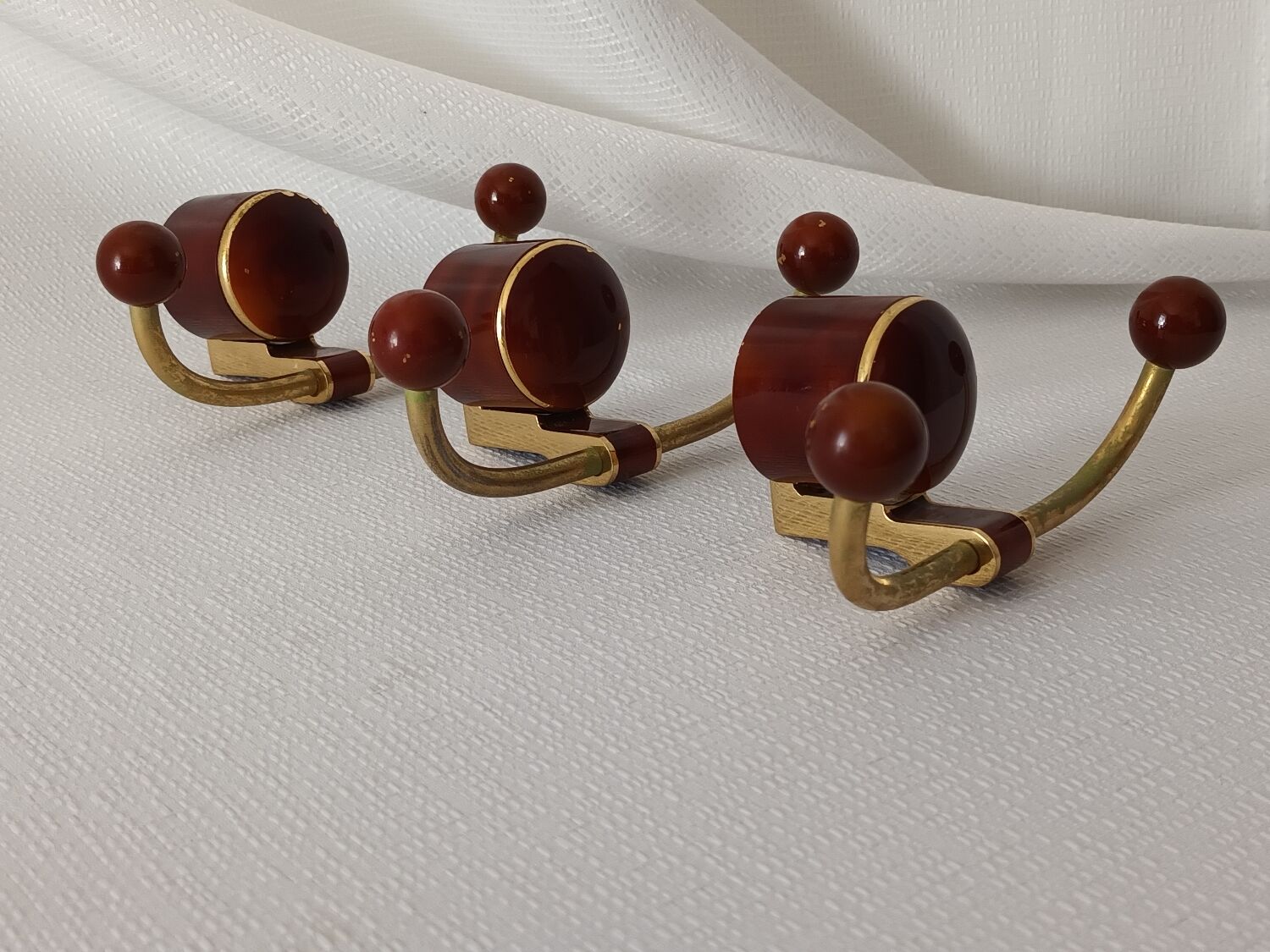 Art deco bakelite brass hooks
