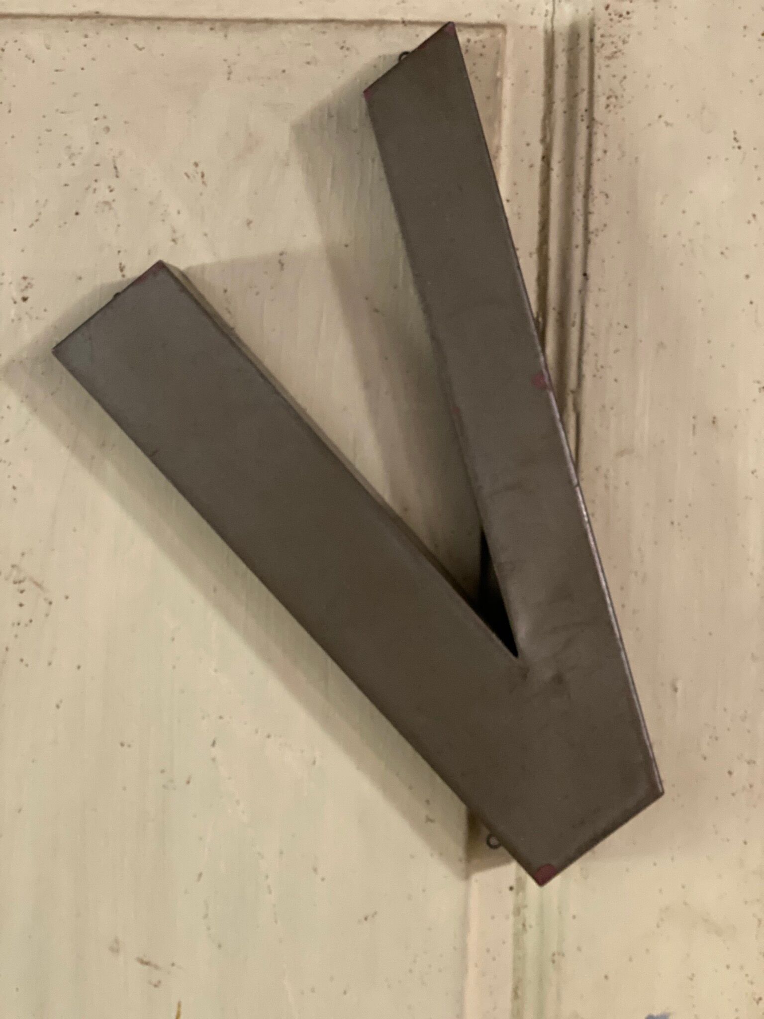 Metal letter V